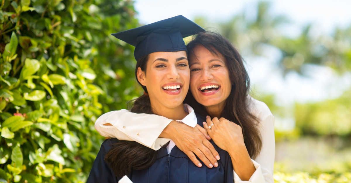18 Year old graduate smiling with divorced mother