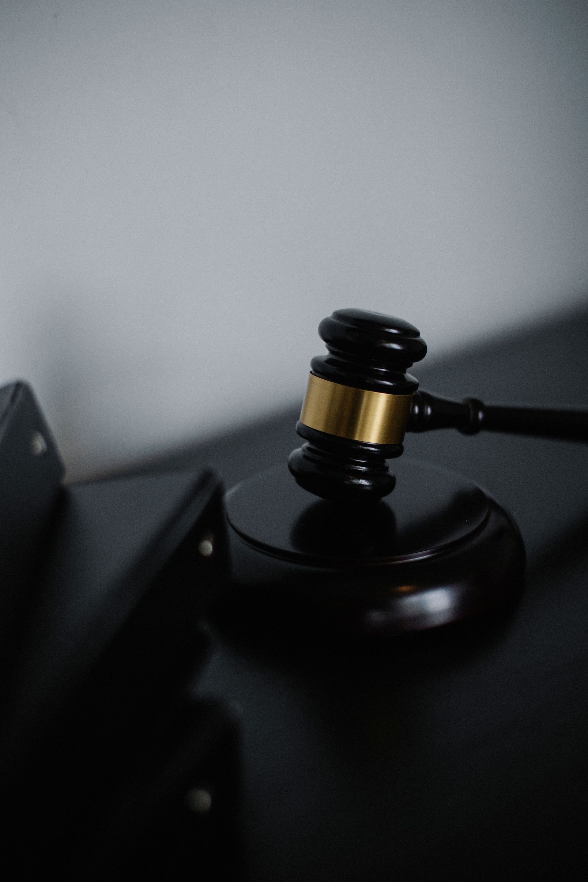 black and gold gavel on desk