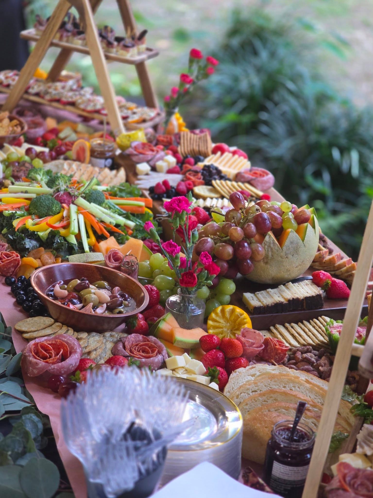 Colorful fruit and vegetable display on a table, arranged like a decorative market spread