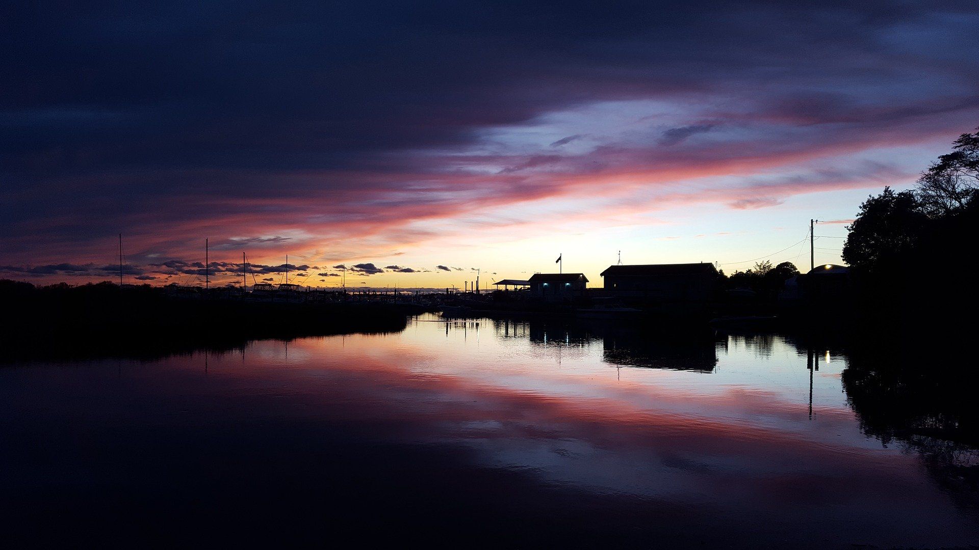 Sunset at dusk over the water in Clinton, Connecticut.