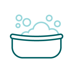 A teal bathtub with bubbles.
