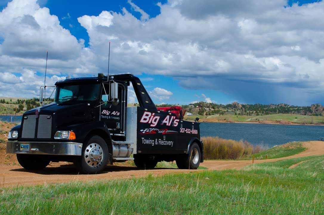 Hooking Tow Cable on Car — Cheyenne, WY — Big Al’s Towing & Recovery Hooking Tow Cable on Car — Cheyenne, WY — Big Al’s Towing & Recovery