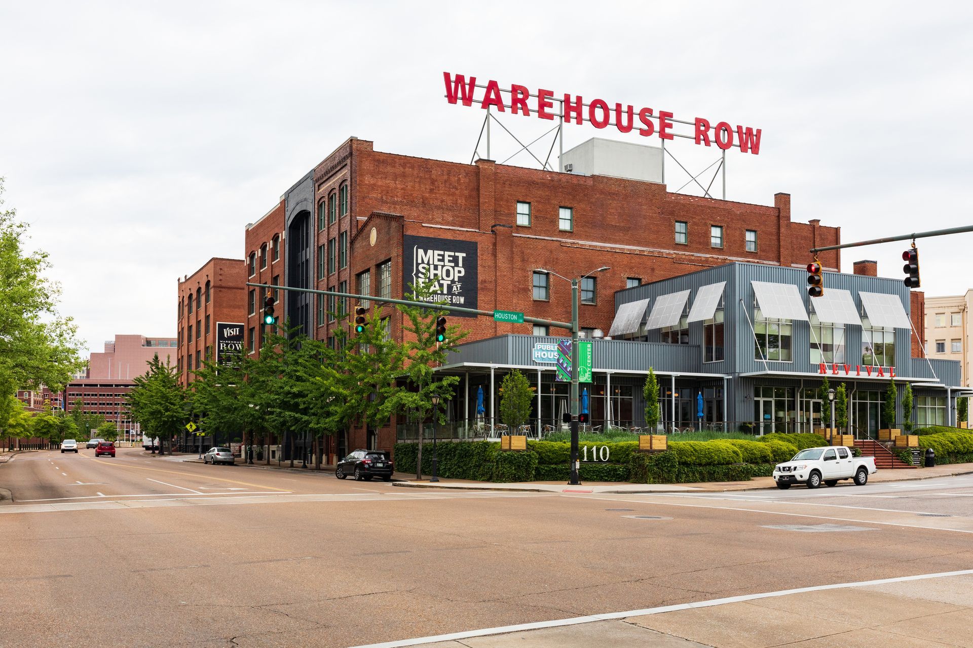 A large brick building with the word warehouse row on top of it