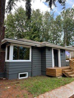 After Exterior Painting with trees background — Seattle, WA — Cordeck Painting Services LLC