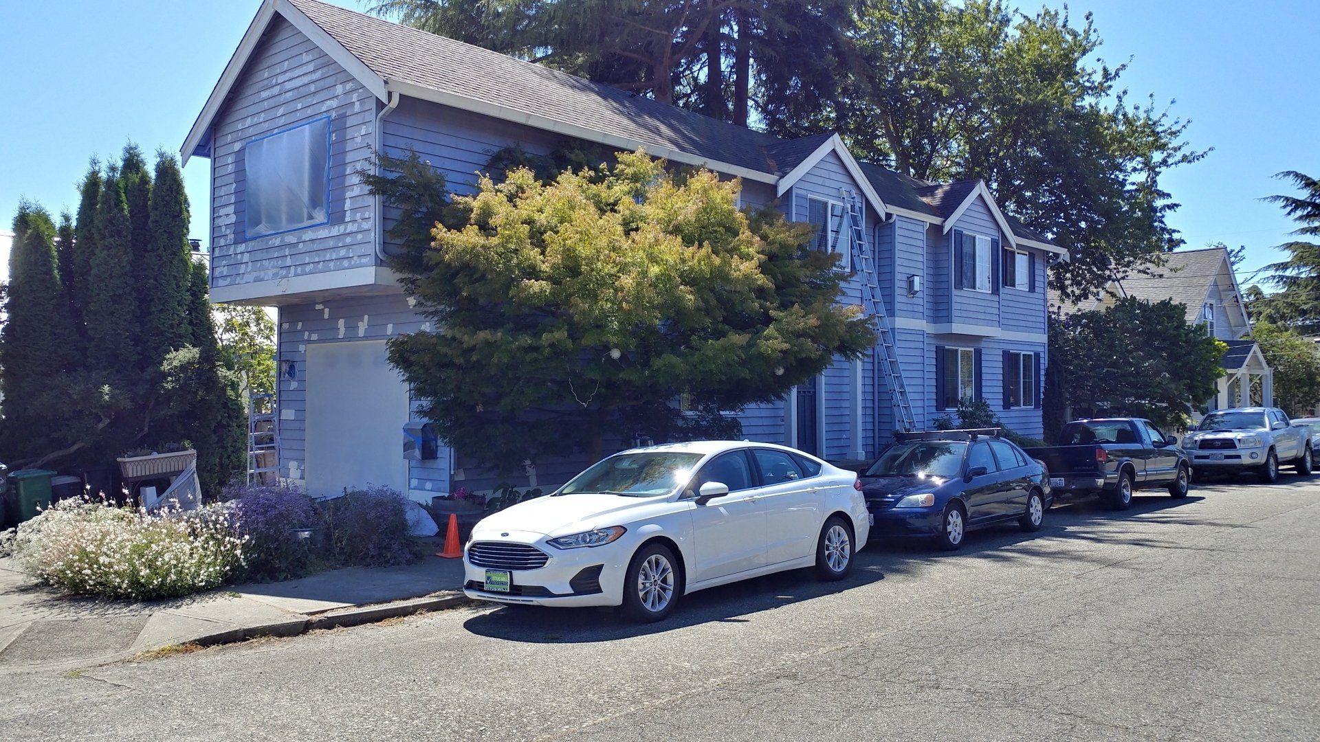 White Car On Front House — Seattle, WA — Cordeck Painting Services LLC