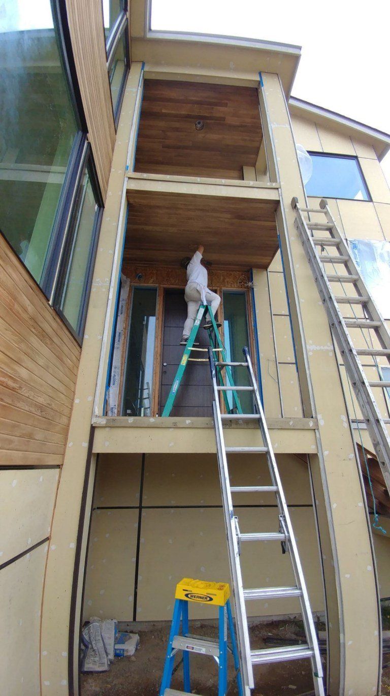 Worker On The Ladder — Seattle, WA — Cordeck Painting Services LLC