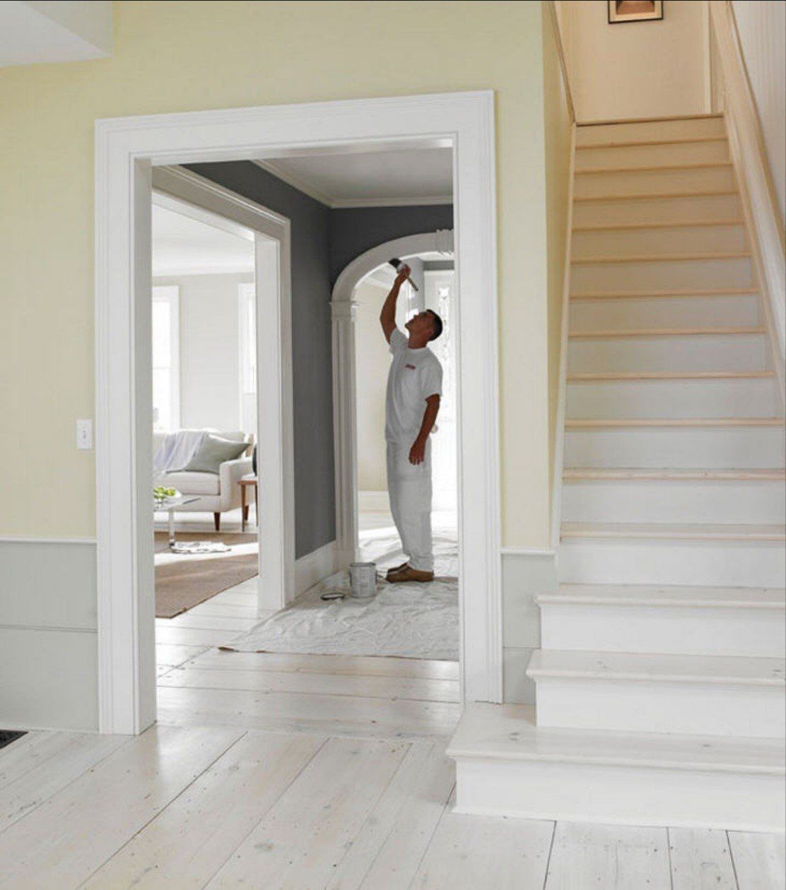 Man Painting The Hallway Arc — Seattle, WA — Cordeck Painting Services LLC