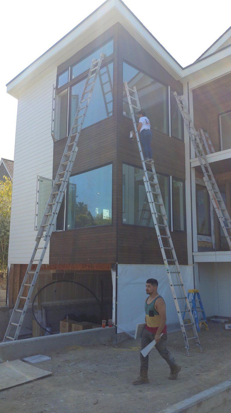 Worker Using Long Ladders — Seattle, WA — Cordeck Painting Services LLC
