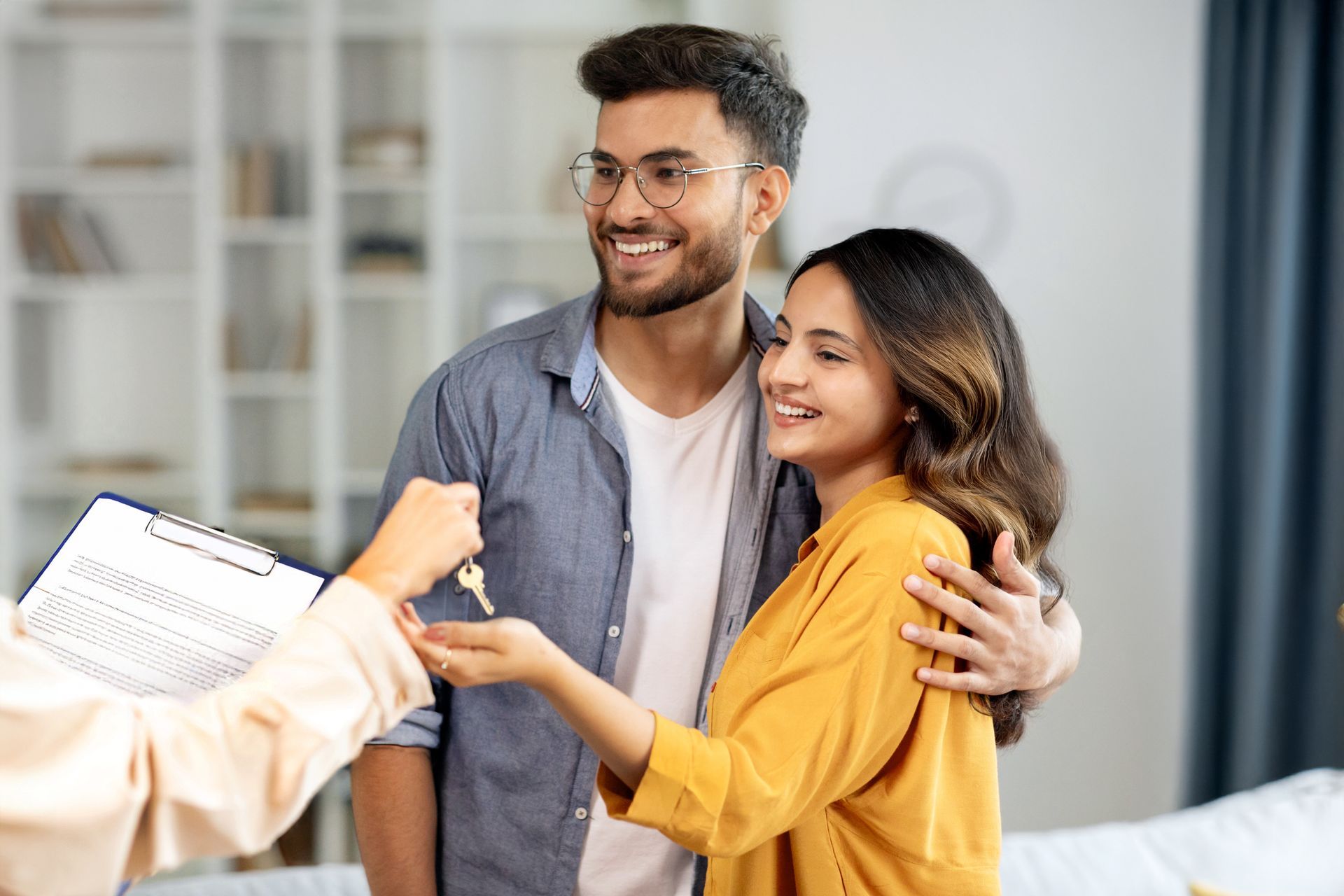 couple getting the keys to their new home