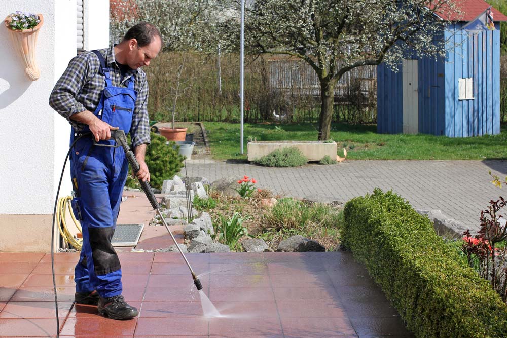 Cleaner Using A Pressure Washer — ACME Cleaning In Tuggerah, NSW