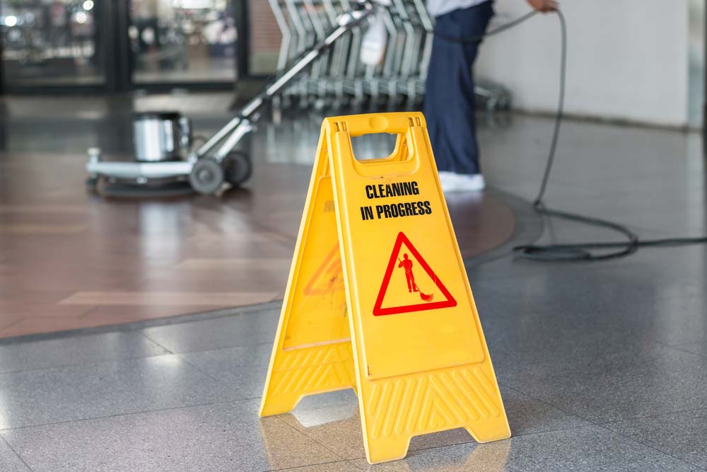 Worker Cleaning The Floor With Polishing Machine — ACME Cleaning In Kariong, NSW