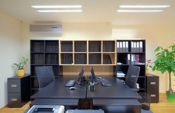 Office Table With A Bunch Of Equipment — ACME Cleaning In Kariong, NSW