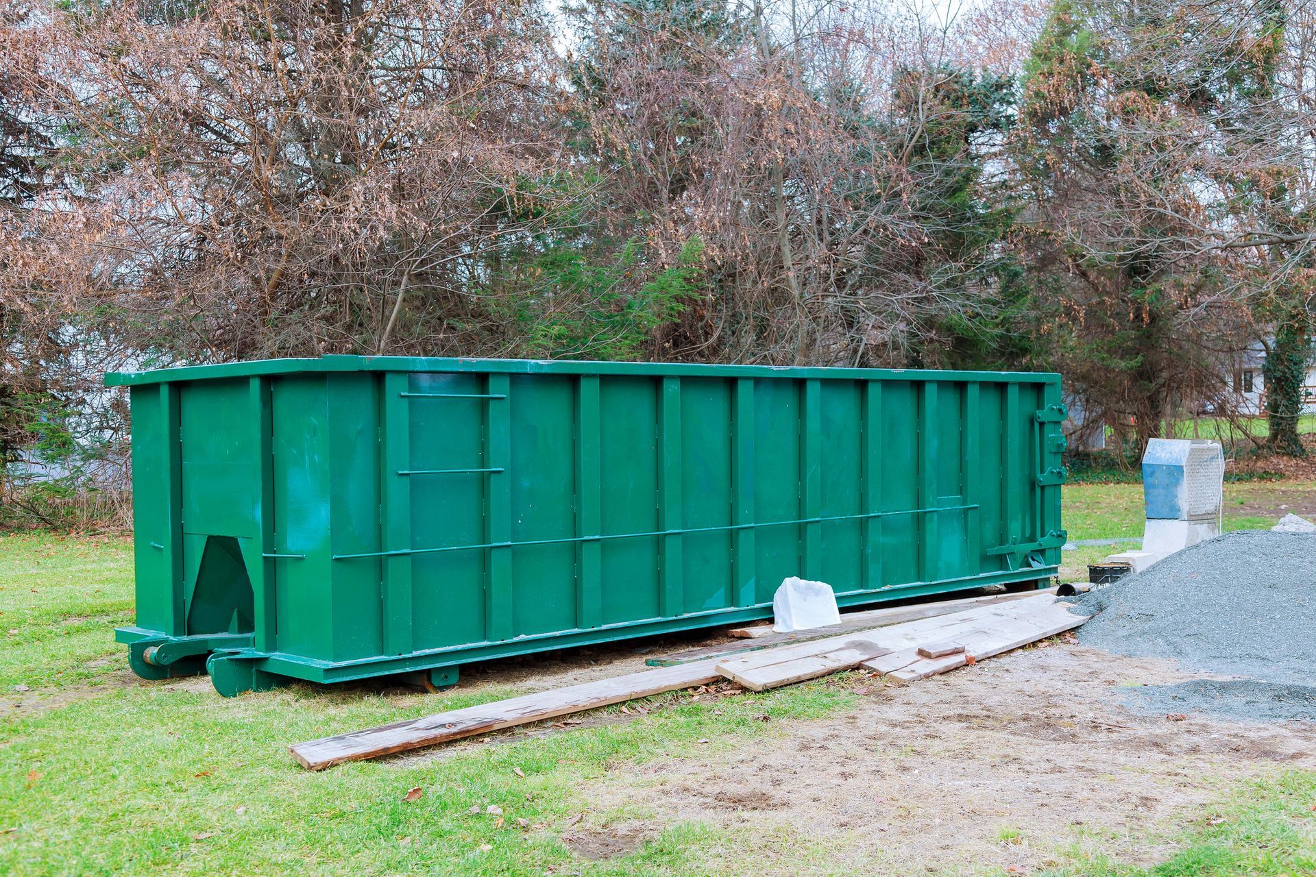 Residential construction debris in a dumpster by K & S Rolloff, providing dumpsters for rent in Terre Haute, IN