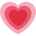 A pink heart with a red heart inside of it on a white background.