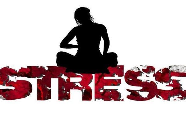 A silhouette of a woman sitting on the word stress
