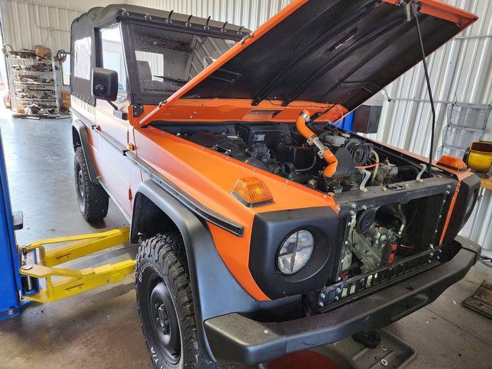 Orange Off-Road Vehicle With Hood Open Inside Auto Repair Shop | Silver Star Automotive