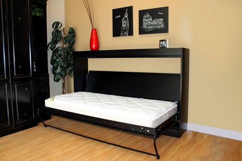 Custom Murphy bed installation showcasing a space-saving wall bed with built-in cabinetry.