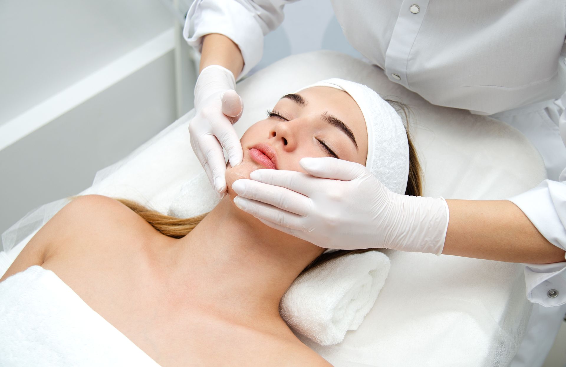 A woman getting a facial beauty treatment in a medical spa center A woman getting a facial beauty treatment in a medical spa center