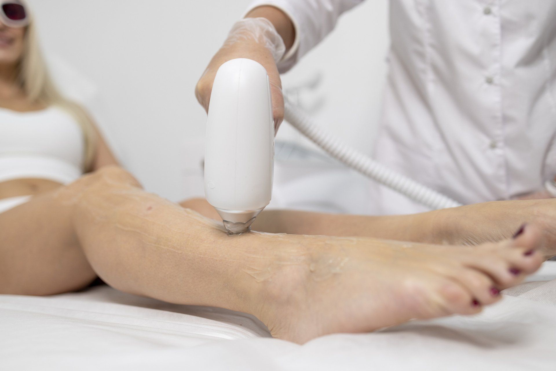Laser Hair Removal On Body Parts - Alamo, CA - Alamo MD Med Spa Laser hair removal treatment on a person's leg. White device and setting.