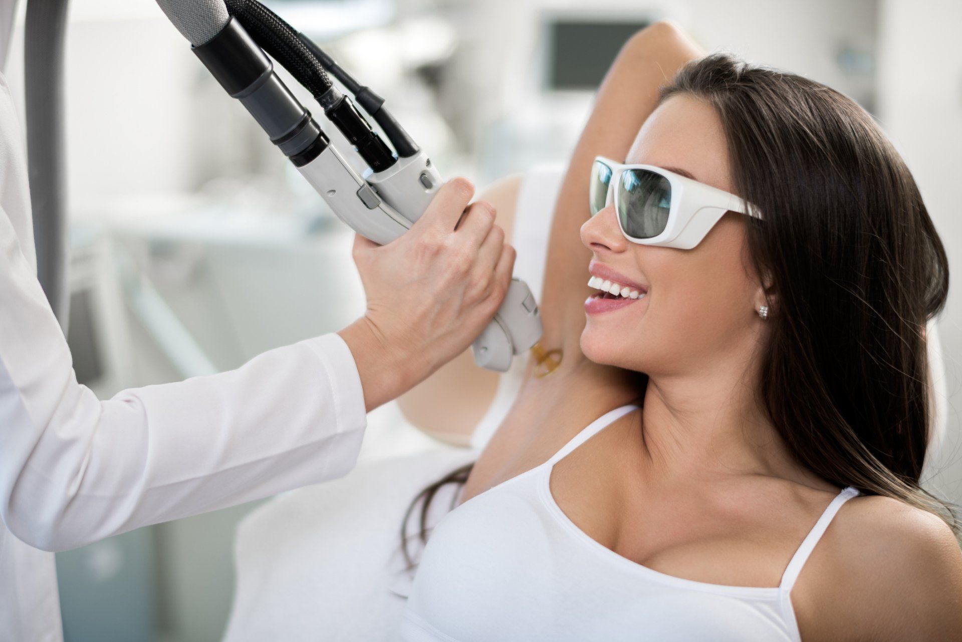 Male Laser Hair Removal - Alamo, CA - Alamo MD Med Spa Woman receiving laser hair removal treatment on her underarm.