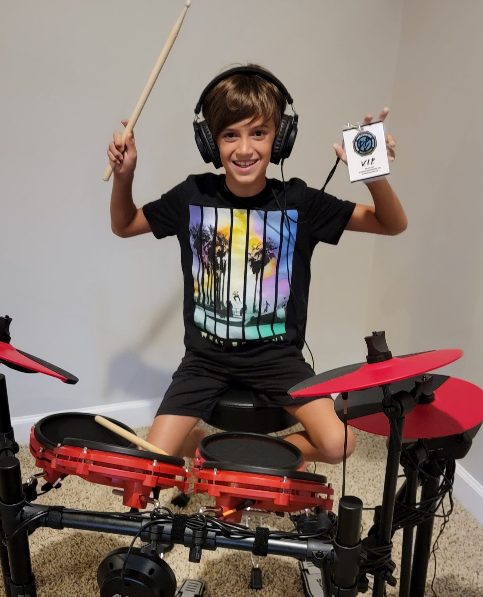 Kid practicing the drums at home