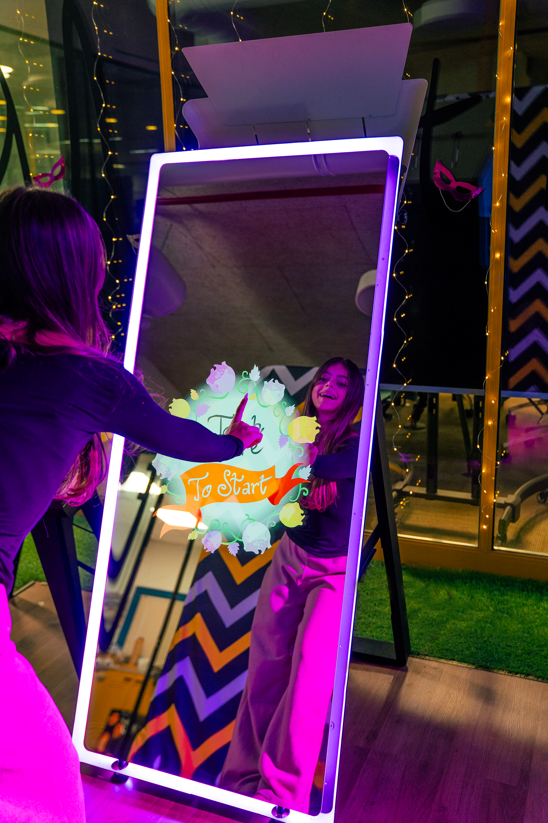 Person interacting with Mirror AIR Photo Booth 