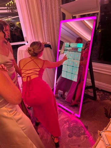 Person adding phone number for photo text with Mirror AIR Photo Booth