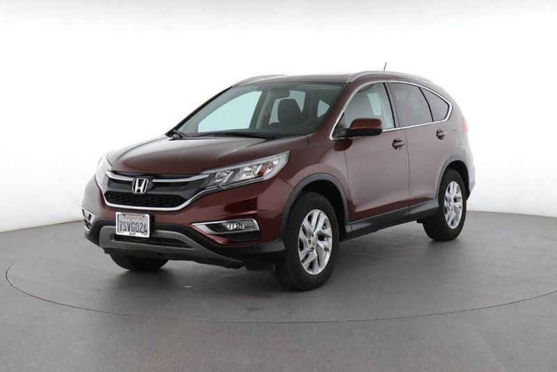 Maroon Honda CR-V SUV angled on a white studio backdrop