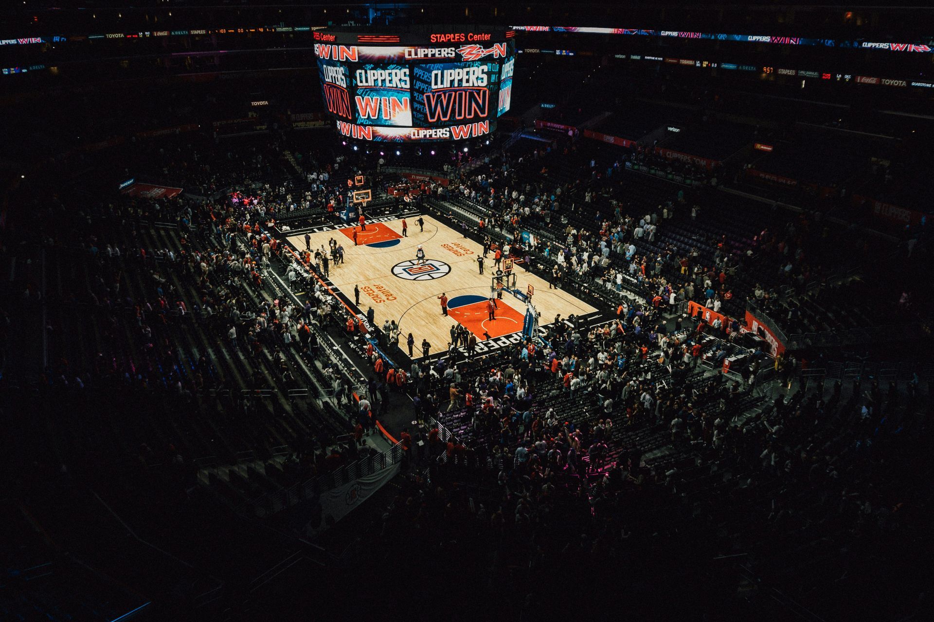 An aerial view of a basketball game in a stadium.