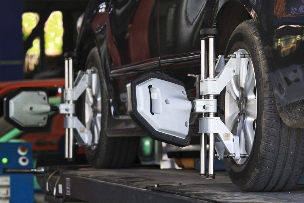 A Car is Being Aligned With a Machine in a Garage — Stamford Tyres In Ballarat Central, VIC