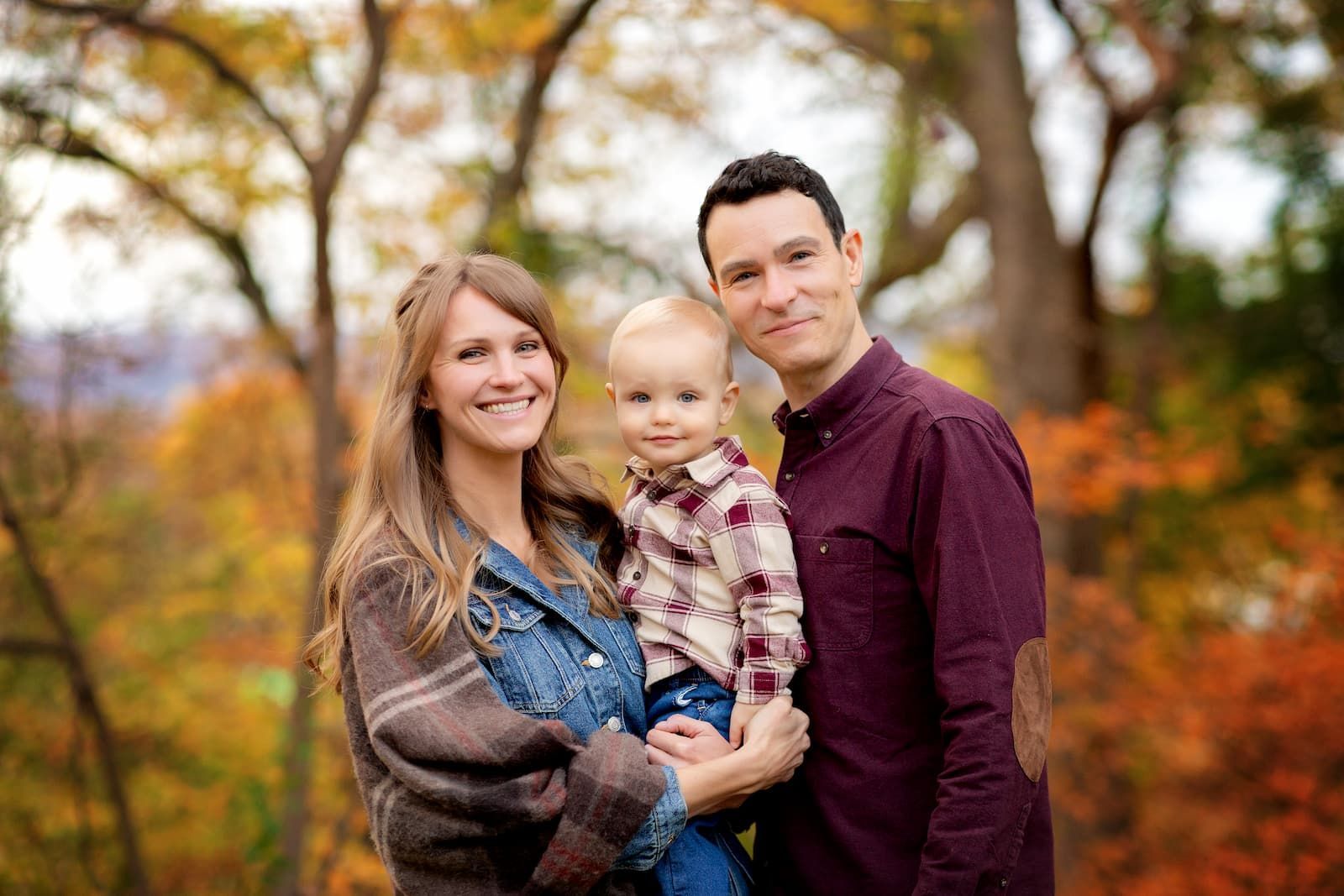 Family of three during a fall family photography session in Bergen County, NJ.