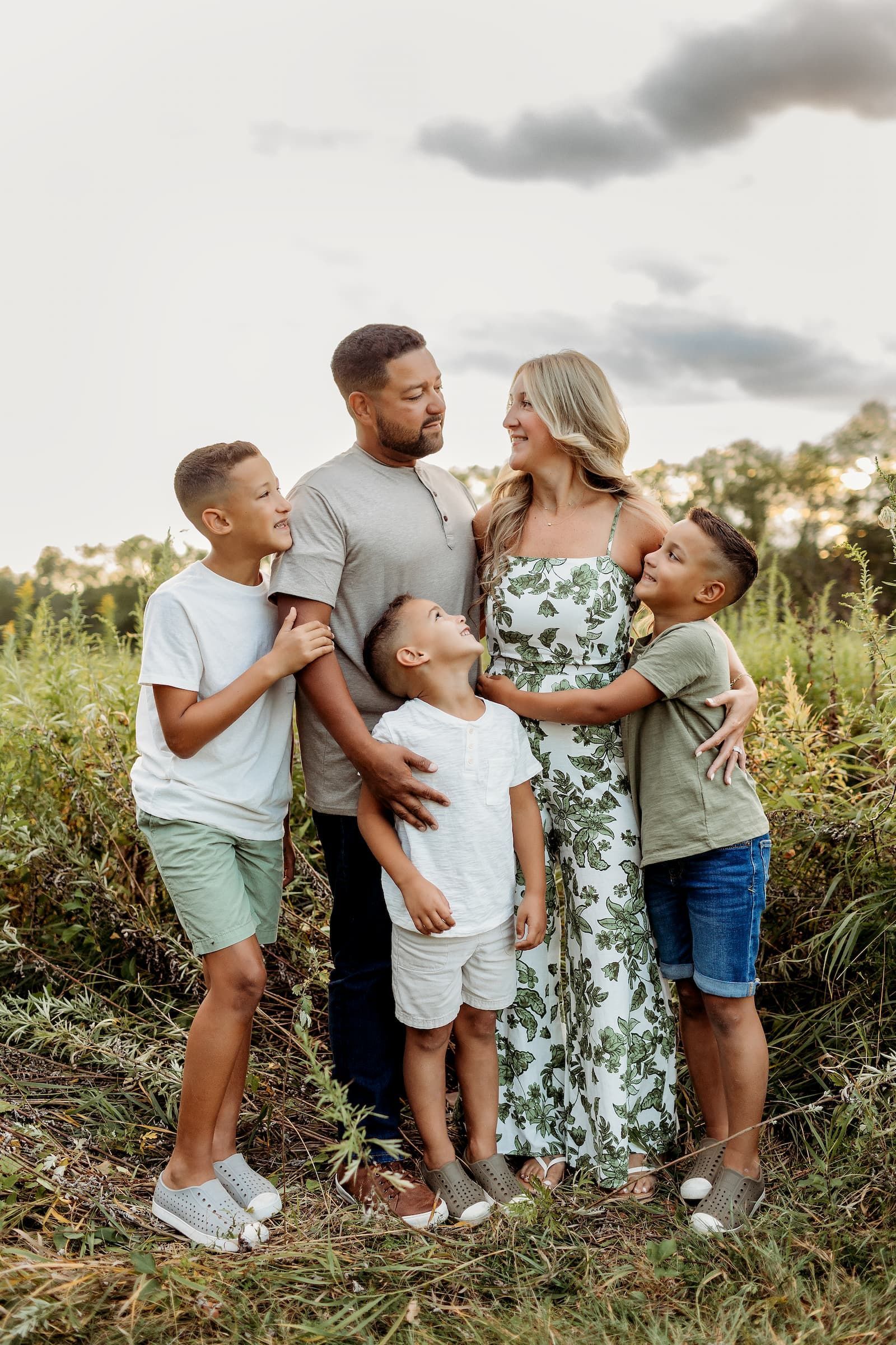 Family of five together during a summer outdoor family photography session in Bergen County, NJ.