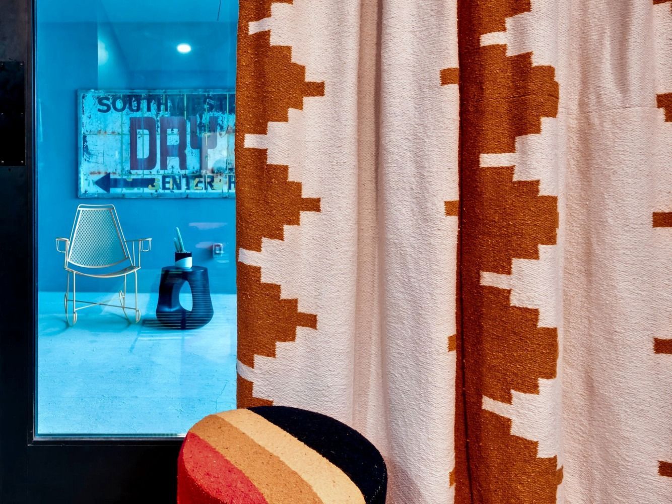 A room with a chair and a sign that says southwest drive