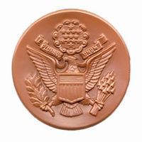 Brown circular seal with an eagle, the US symbol, and the text 