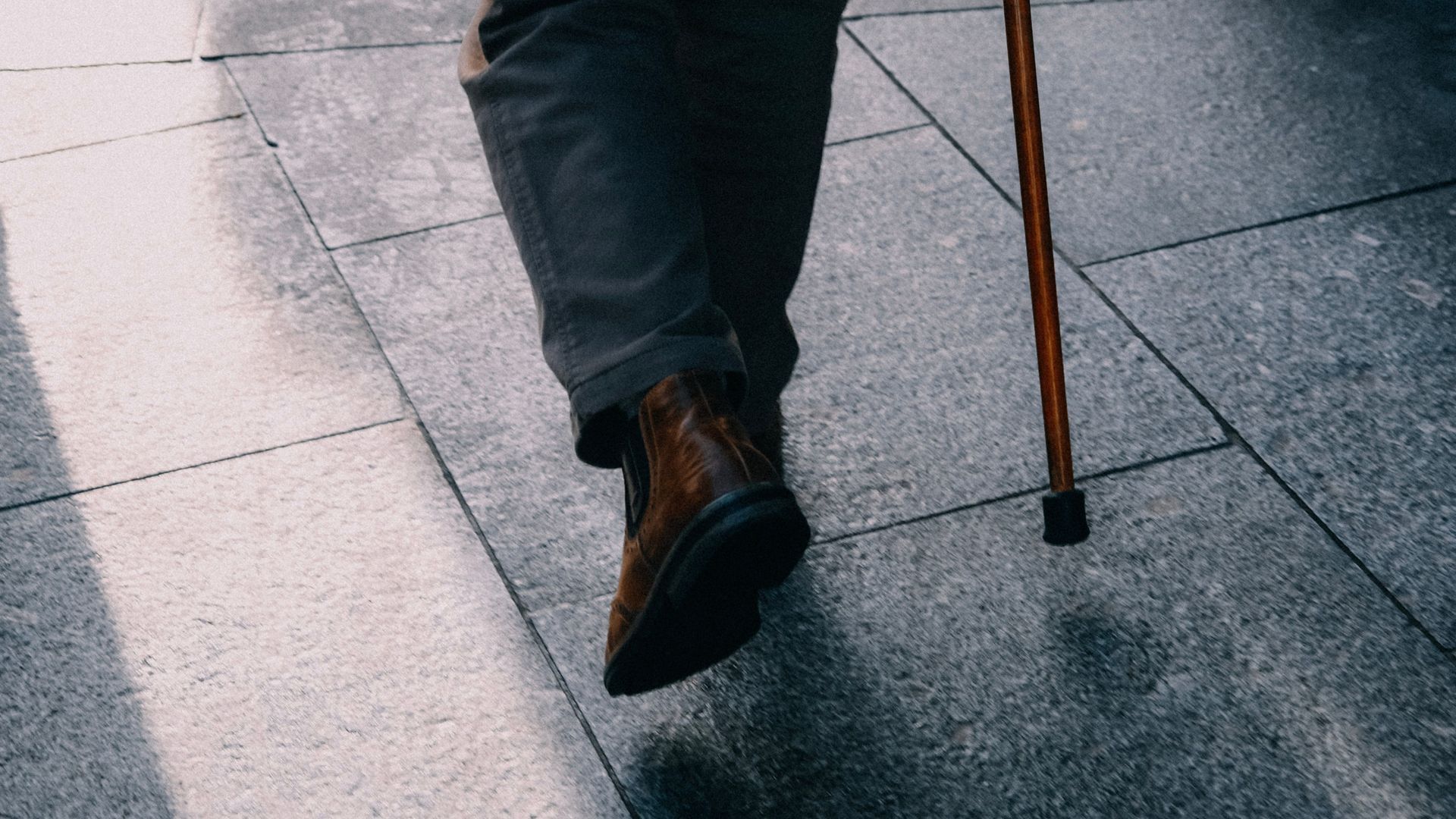 Person Walking with a Cane in Buffalo, NY