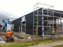 A large building is being built with scaffolding around it.