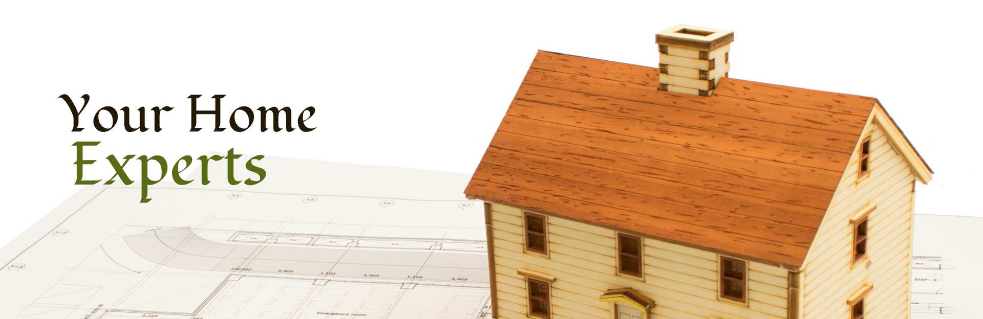 A model house sitting on architectural blueprints next to the text