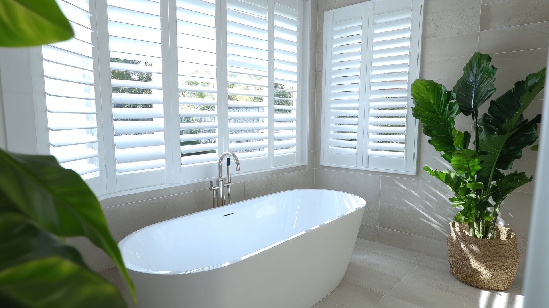 A luxury bathroom with elegant interior window shutters at Accent Blinds near Lexington and Chapin, SC