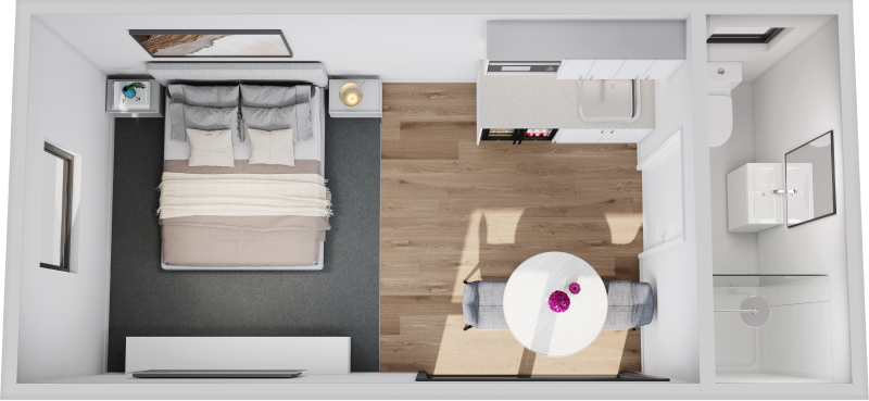 Top-down view of a small bedroom with a bed, desk, chair, wardrobe, and bathroom area