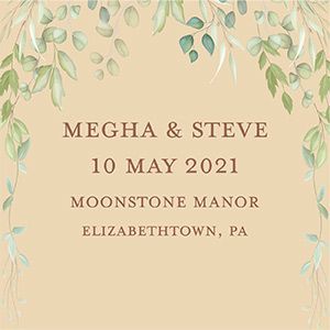 A wedding invitation with green leaves on a beige background.