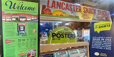 A sign that says welcome lancaster snack shack on it
