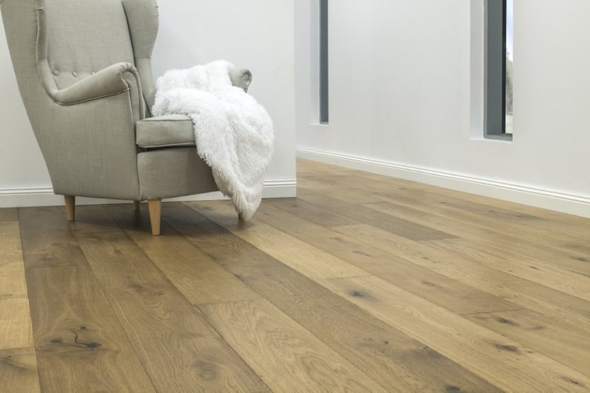 Grey Chair on Timber Floor — Flooring Suppliers in Port Macquarie, NSW