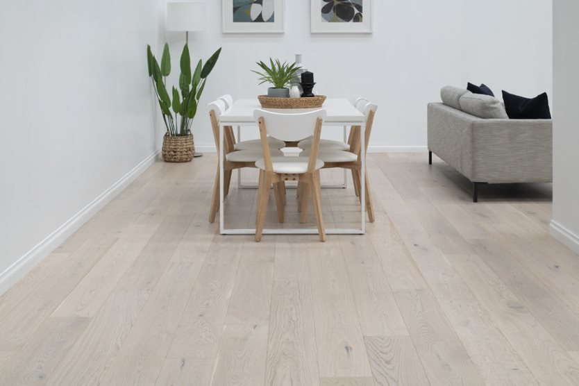 White Dining Table on Timber Flooring — Flooring Suppliers in Port Macquarie, NSW