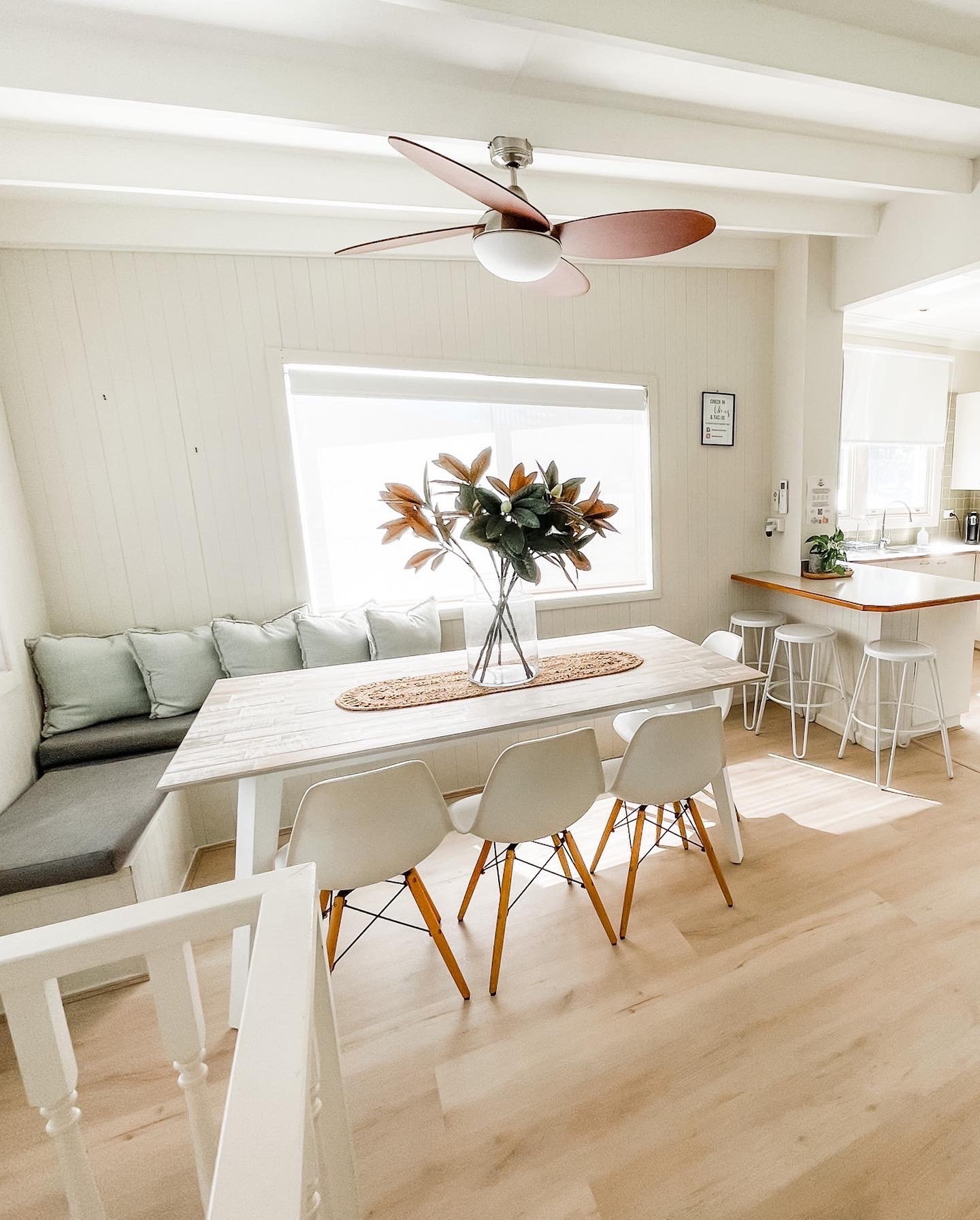 A Dining Room With A Table And Chairs And A Ceiling Fan — Flooring Suppliers in Port Macquarie, NSW