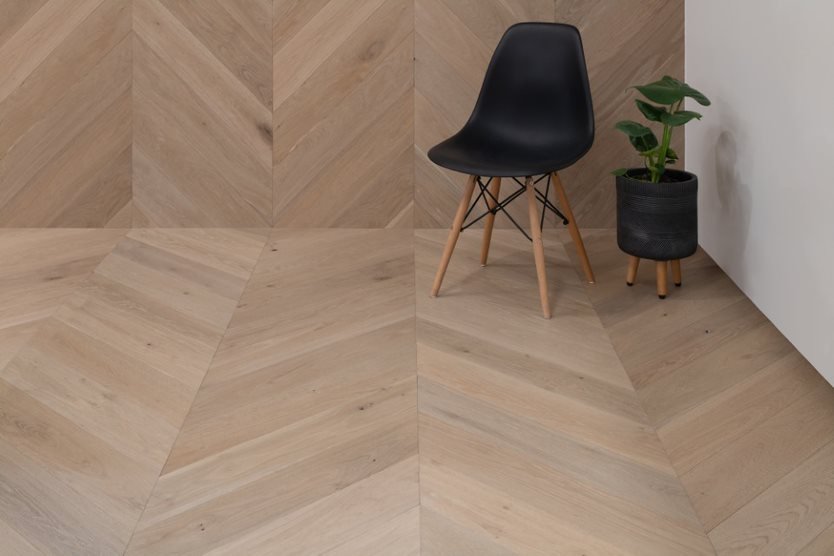 Black Chair on Engineered Timber Flooring — Flooring Suppliers in Port Macquarie, NSW