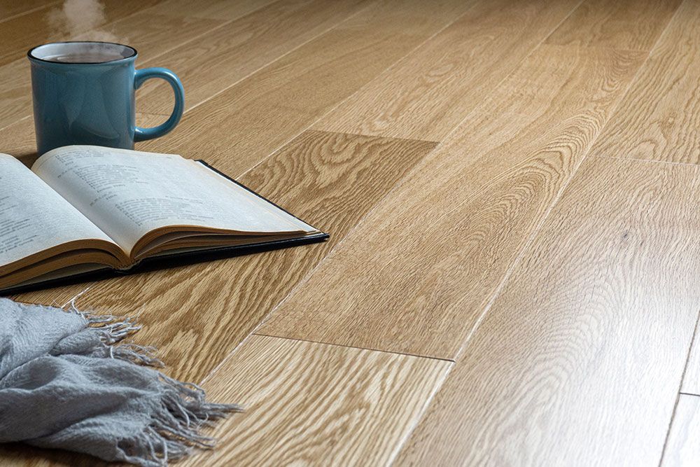 Coffee book and scarf in the floor — Flooring Store Near Taree, NSW