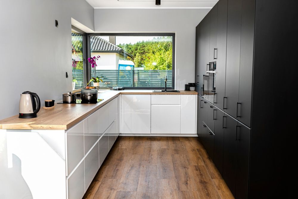 Dark cabinet in the kitchen — Floor Coverings in Kempsey, NSW
