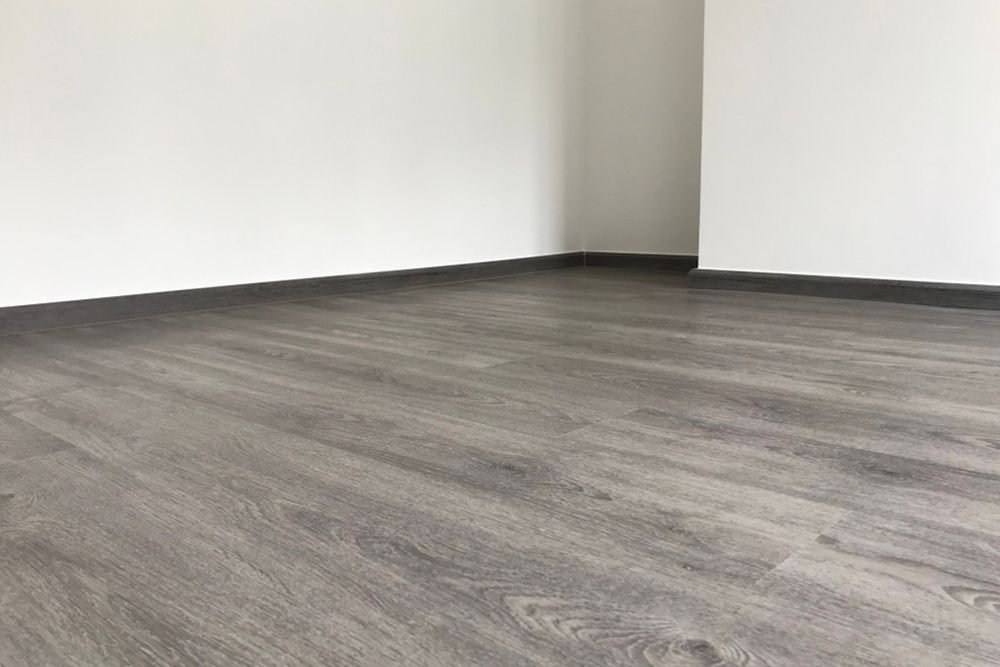 Dark vinyl floor — Flooring Store Near Kempsey, NSW