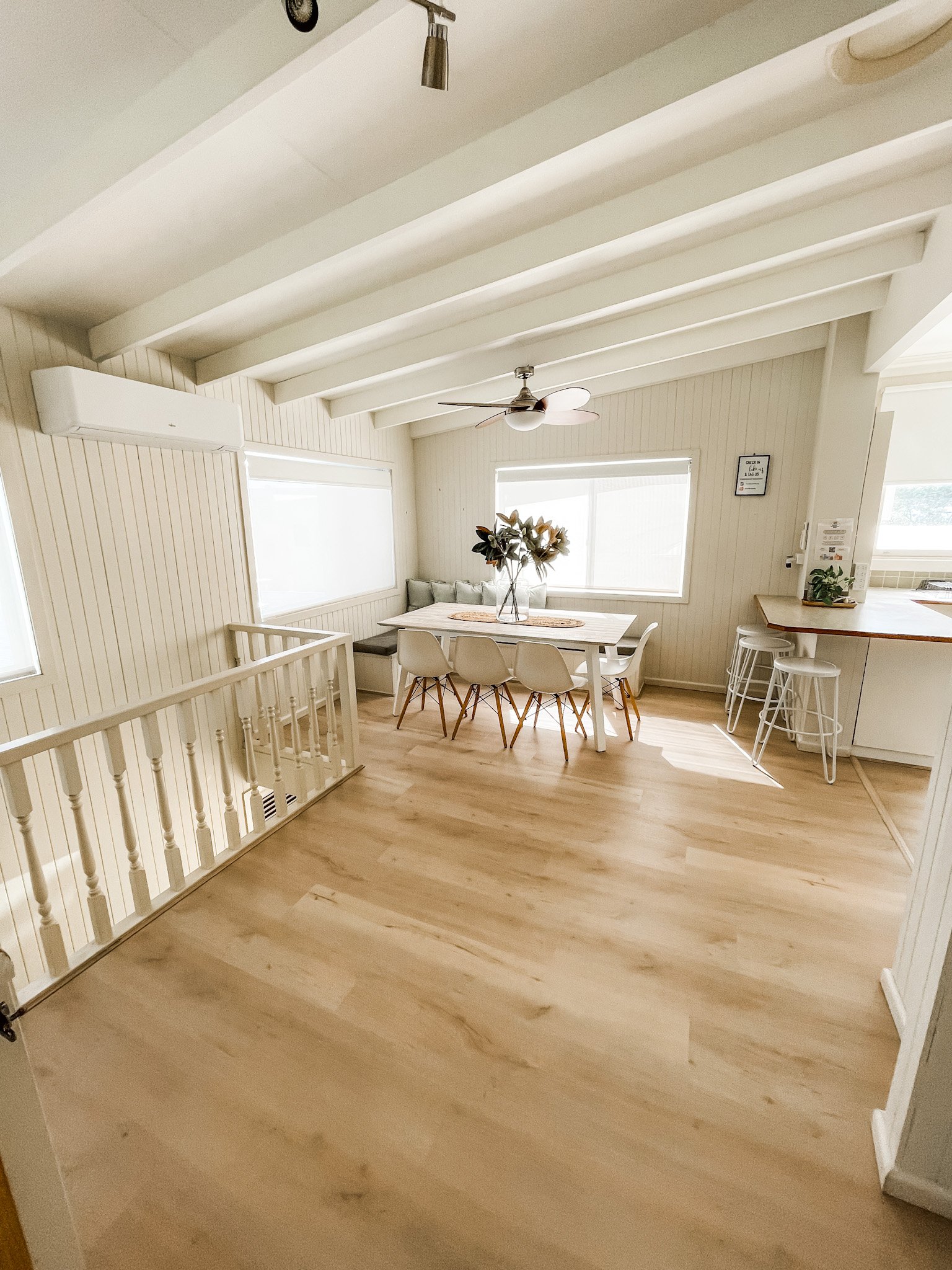 There Is A Table And Chairs In The Middle Of The Room — Flooring Suppliers in Port Macquarie, NSW