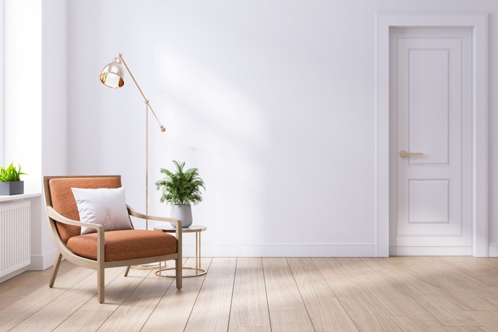 Living room with chair spotlight and plants — Flooring Suppliers in Wauchope, NSW